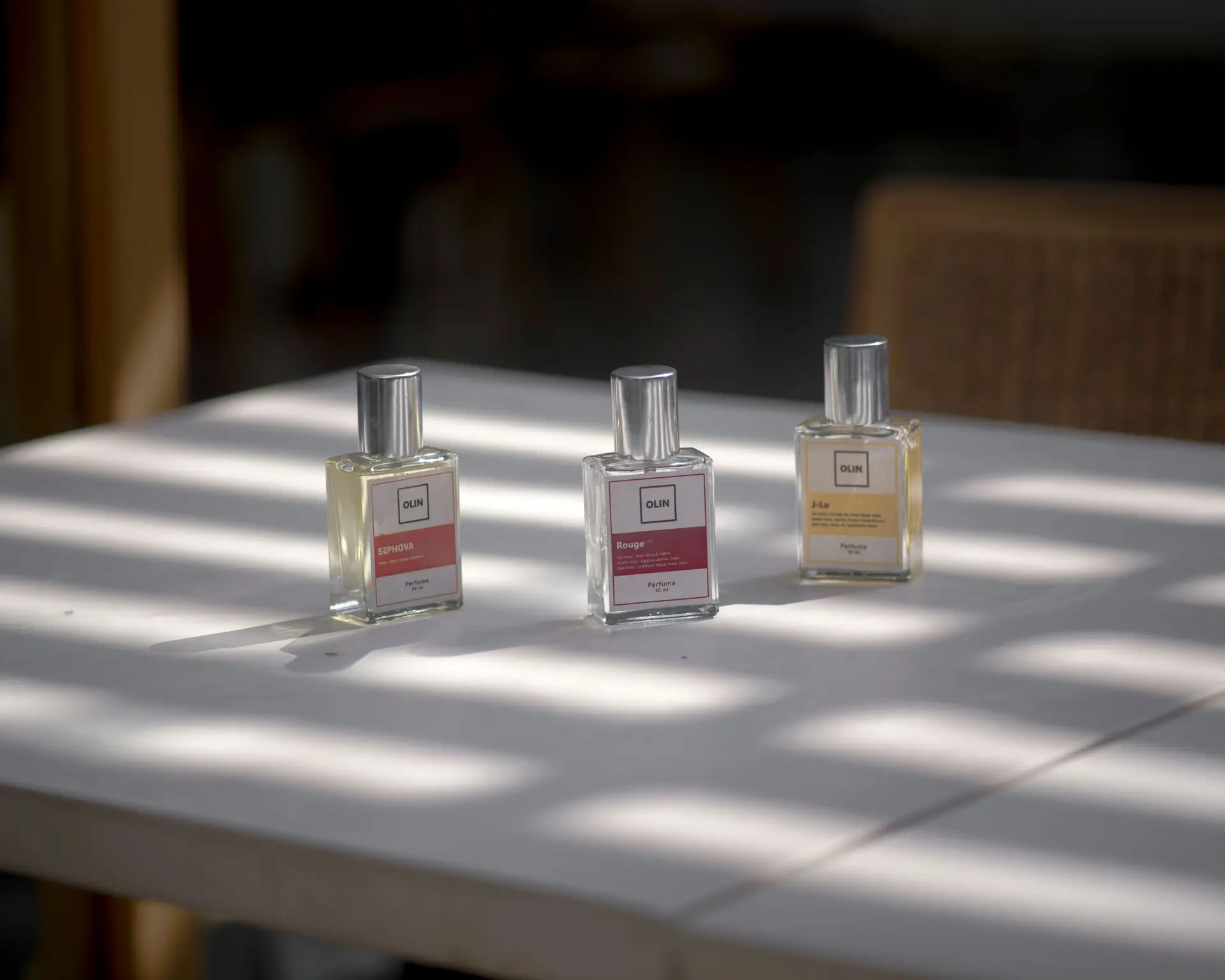 Elegant perfume bottles arranged on a sunlit table